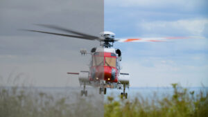 A shot of a helicopter in flight shows the difference before and after colour grading